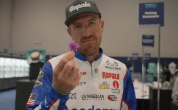 an image of Jacob Wheeler holding an urchin bait at ICAST
