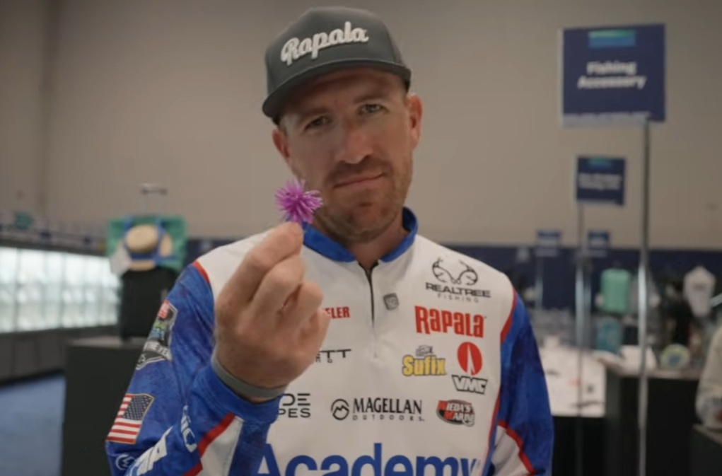 an image of Jacob Wheeler holding an urchin bait at ICAST